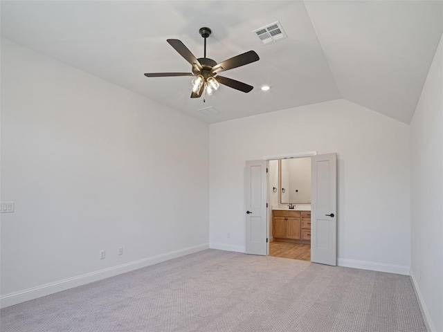 7909 NW 162nd St, Edmond, OK 73013 - unfurnished bedroom featuring lofted ceiling, light carpet, baseboards, ensuite bath, and ceiling fan