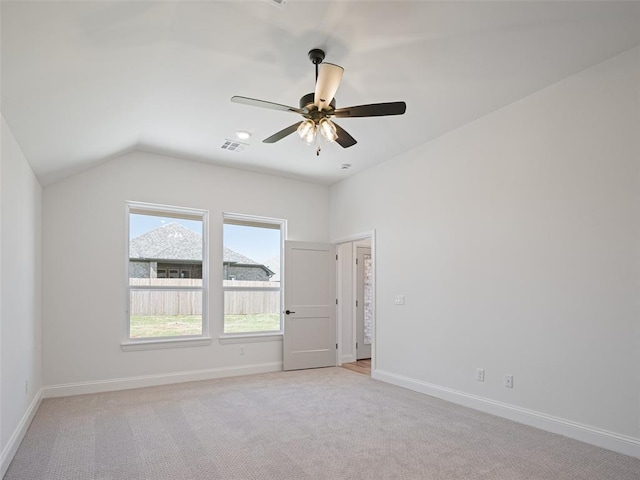 7909 NW 162nd St, Edmond, OK 73013 - empty room featuring light carpet, ceiling fan, baseboards, and lofted ceiling