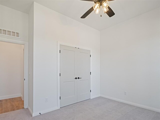 7909 NW 162nd St, Edmond, OK 73013 - unfurnished bedroom with baseboards, carpet floors, and ceiling fan