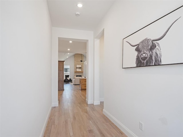 7909 NW 162nd St, Edmond, OK 73013 - hall with light wood finished floors, baseboards, and recessed lighting