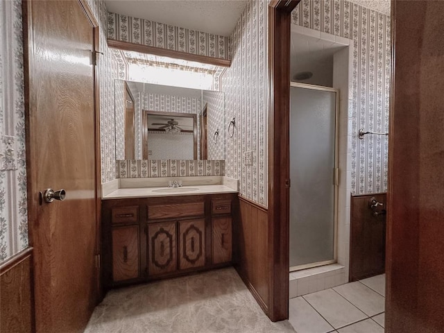 715 N Max, Hinton, OK 73047 - full bathroom featuring wallpapered walls, a stall shower, vanity, a wainscoted wall, and tile patterned flooring