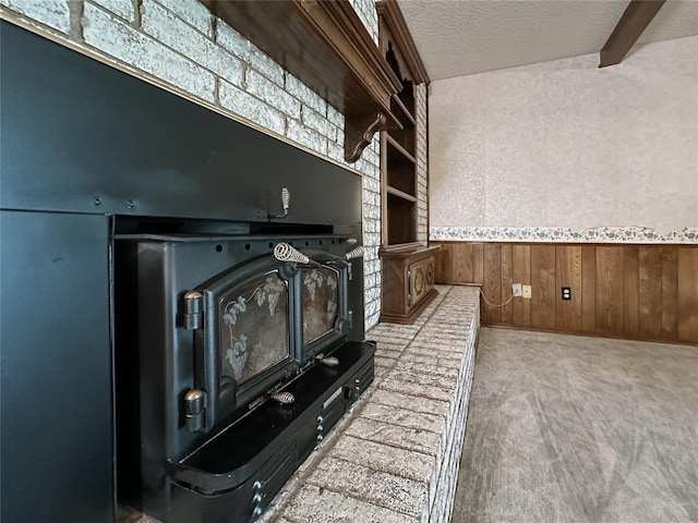 715 N Max, Hinton, OK 73047 - detailed view of a textured ceiling, wood walls, carpet floors, and a wainscoted wall
