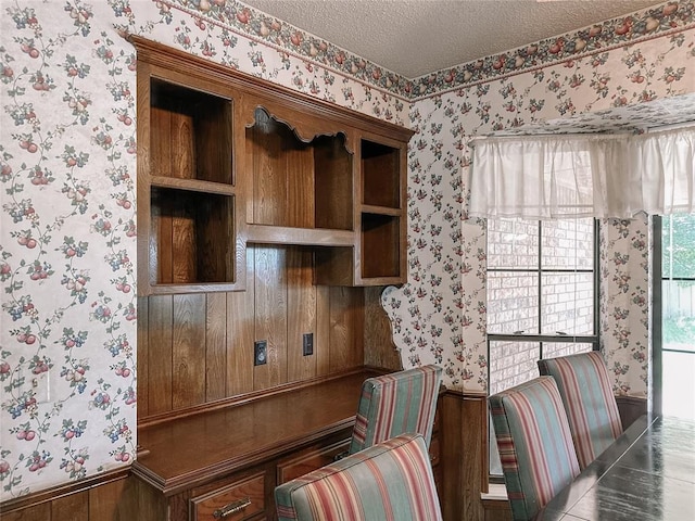 715 N Max, Hinton, OK 73047 - office with wallpapered walls, a textured ceiling, and a wainscoted wall