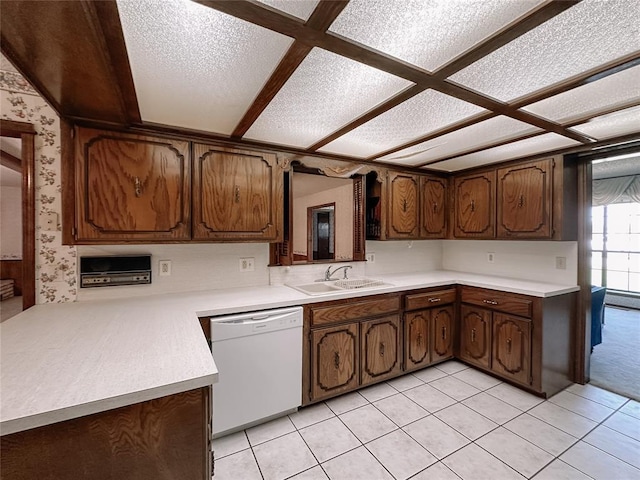 715 N Max, Hinton, OK 73047 - kitchen with dishwasher, wallpapered walls, light countertops, a sink, and light tile patterned floors