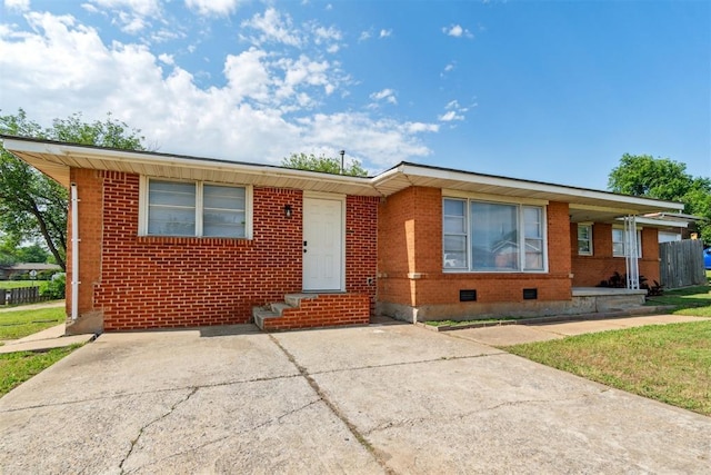 3831 NW Bell Ave, Lawton, OK 73505 - view of front of house with brick siding, crawl space, and entry steps