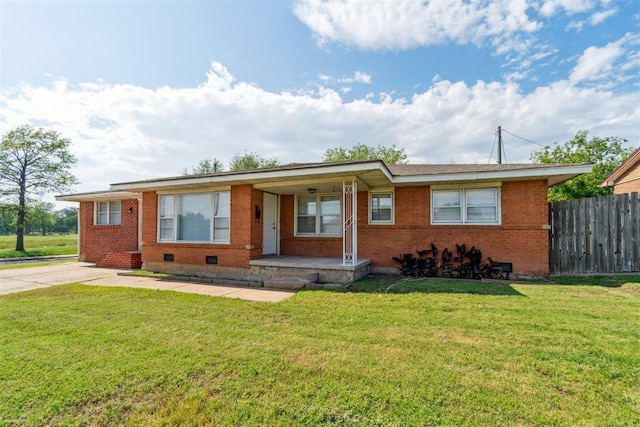 3831 NW Bell Ave, Lawton, OK 73505 - ranch-style house with brick siding, a porch, crawl space, and concrete driveway