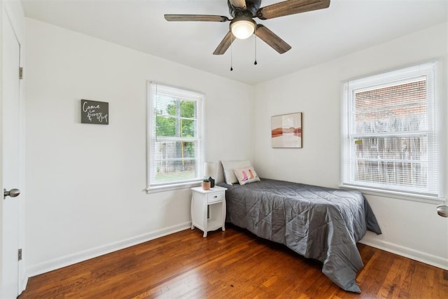 3831 NW Bell Ave, Lawton, OK 73505 - bedroom with wood finished floors, baseboards, and a ceiling fan