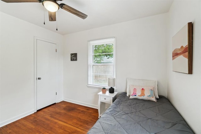 3831 NW Bell Ave, Lawton, OK 73505 - bedroom featuring wood finished floors, baseboards, and a ceiling fan