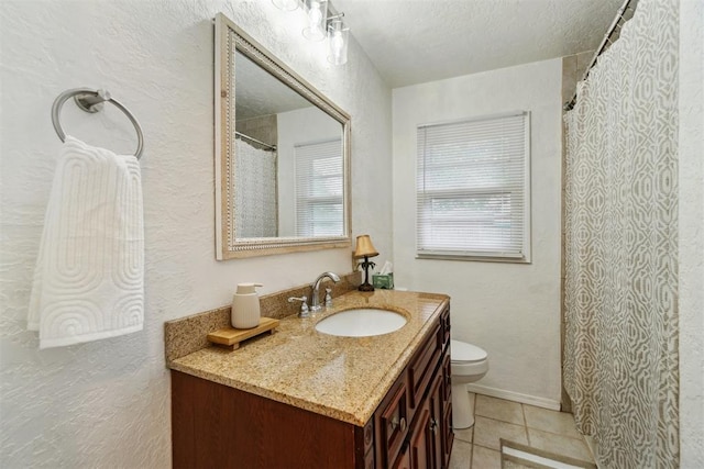 3831 NW Bell Ave, Lawton, OK 73505 - bathroom with tile patterned floors, vanity, and toilet