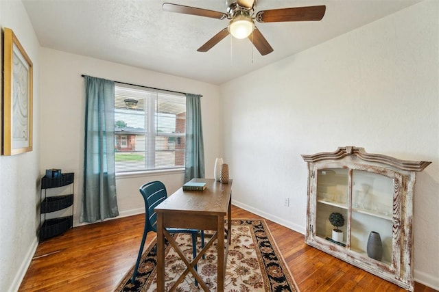 3831 NW Bell Ave, Lawton, OK 73505 - home office featuring wood finished floors, ceiling fan, and baseboards