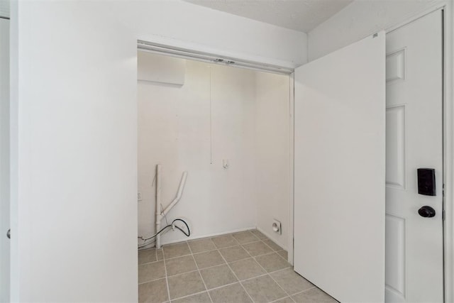 3831 NW Bell Ave, Lawton, OK 73505 - laundry room featuring light tile patterned floors