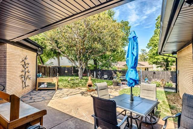 11100 Willow Grove Rd, Oklahoma City, OK 73120 - fenced backyard with outdoor dining area and a patio