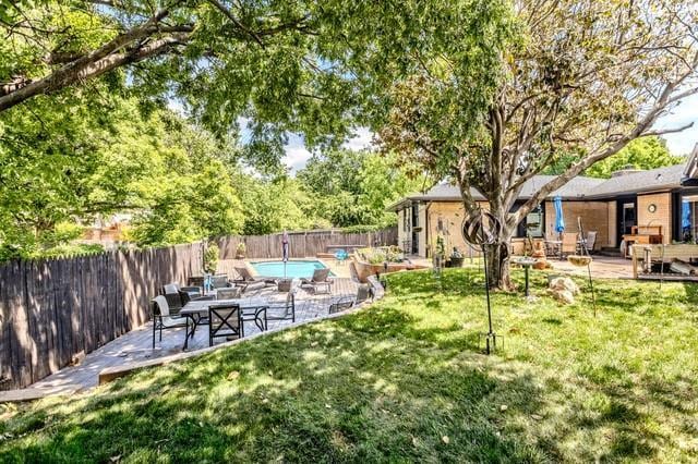 11100 Willow Grove Rd, Oklahoma City, OK 73120 - fenced backyard featuring a patio
