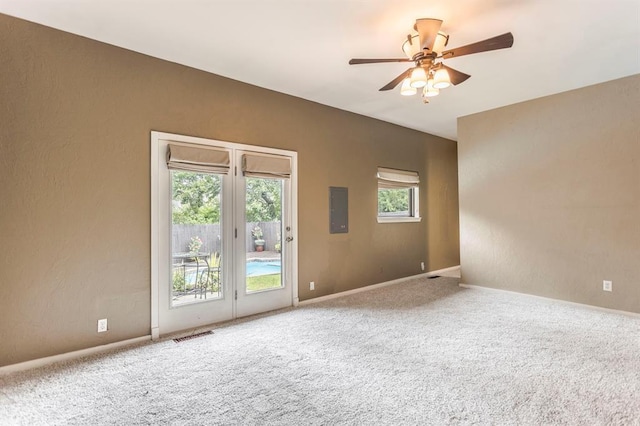 11100 Willow Grove Rd, Oklahoma City, OK 73120 - unfurnished room with electric panel, a textured wall, ceiling fan, and carpet flooring
