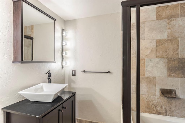 11100 Willow Grove Rd, Oklahoma City, OK 73120 - bathroom with vanity, a textured wall, and shower / bath combination
