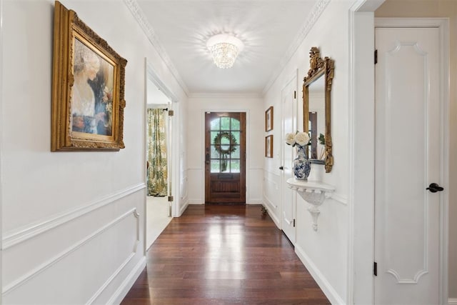 1201 Westchester Dr, Oklahoma City, OK 73114 - entryway with a chandelier, dark wood-type flooring, a decorative wall, and ornamental molding
