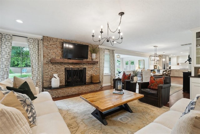 1201 Westchester Dr, Oklahoma City, OK 73114 - living area featuring a chandelier, ornamental molding, a fireplace, light wood-style flooring, and recessed lighting