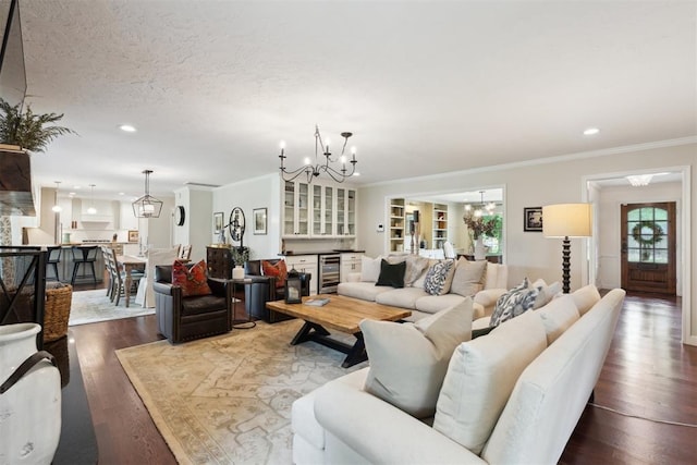 1201 Westchester Dr, Oklahoma City, OK 73114 - living area featuring a chandelier, crown molding, wood finished floors, recessed lighting, and wine cooler