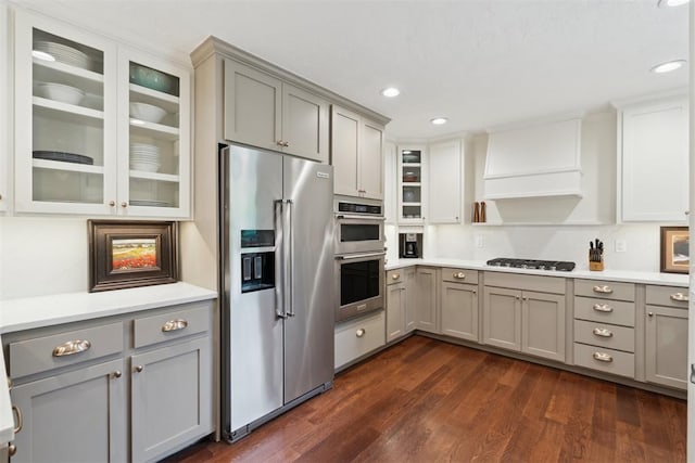 1201 Westchester Dr, Oklahoma City, OK 73114 - kitchen with stainless steel appliances, gray cabinets, light countertops, glass insert cabinets, and recessed lighting