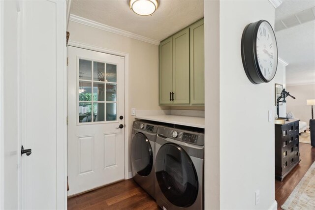 1201 Westchester Dr, Oklahoma City, OK 73114 - laundry room with cabinet space, independent washer and dryer, dark wood-style flooring, and crown molding