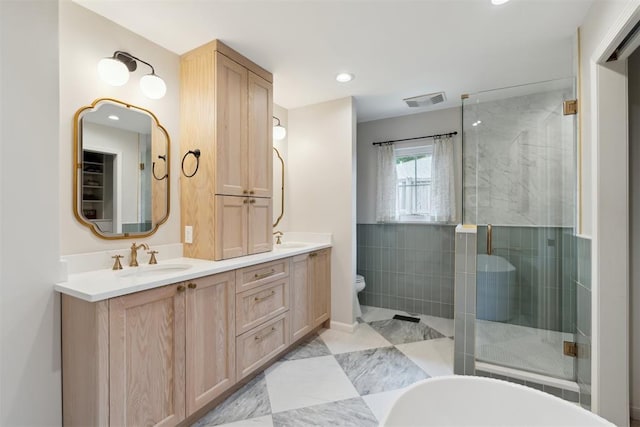 1201 Westchester Dr, Oklahoma City, OK 73114 - full bath with a stall shower, double vanity, toilet, a bathtub, and recessed lighting