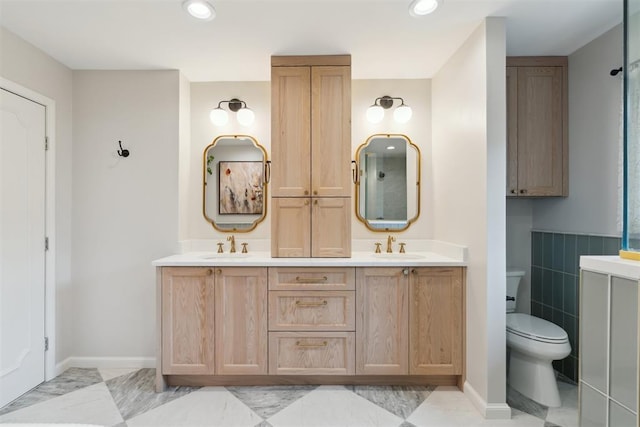 1201 Westchester Dr, Oklahoma City, OK 73114 - full bathroom featuring double vanity, toilet, recessed lighting, and baseboards
