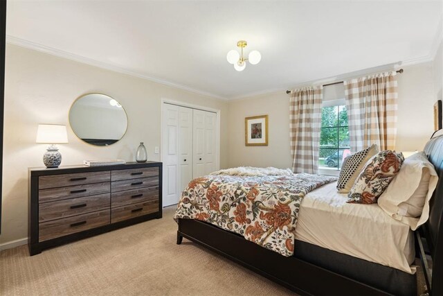 1201 Westchester Dr, Oklahoma City, OK 73114 - bedroom featuring ornamental molding, a closet, and light colored carpet