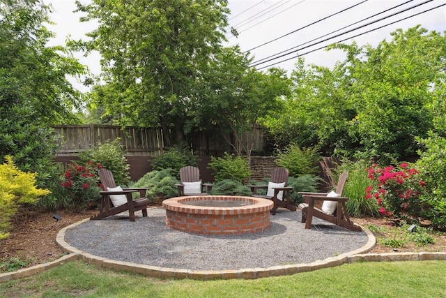 1201 Westchester Dr, Oklahoma City, OK 73114 - view of patio / terrace with a fire pit