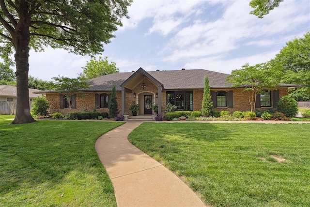 1201 Westchester Dr, Oklahoma City, OK 73114 - view of front facade featuring a front yard and brick siding