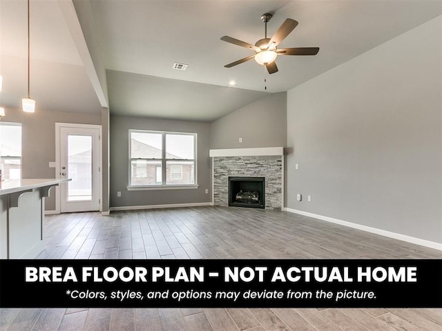 1100 Redwood Creek Dr, Yukon, OK 73099 - unfurnished living room with lofted ceiling, wood finished floors, a ceiling fan, baseboards, and a fireplace