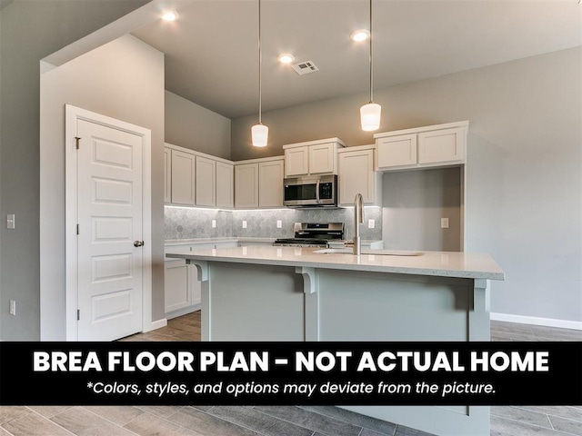 1100 Redwood Creek Dr, Yukon, OK 73099 - kitchen featuring stainless steel appliances, tasteful backsplash, and white cabinetry
