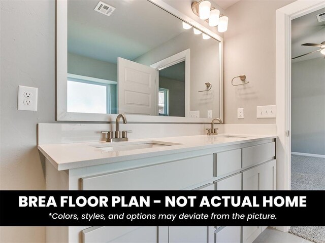 1100 Redwood Creek Dr, Yukon, OK 73099 - bathroom with double vanity and ceiling fan