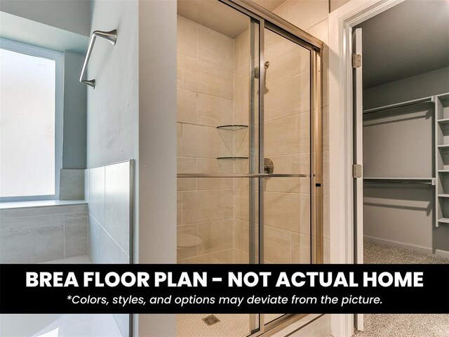 1100 Redwood Creek Dr, Yukon, OK 73099 - bathroom featuring a stall shower, a walk in closet, and plenty of natural light