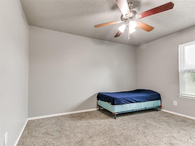 216 N English Dr, Moore, OK 73160 - carpeted bedroom with a textured ceiling, ceiling fan, and baseboards