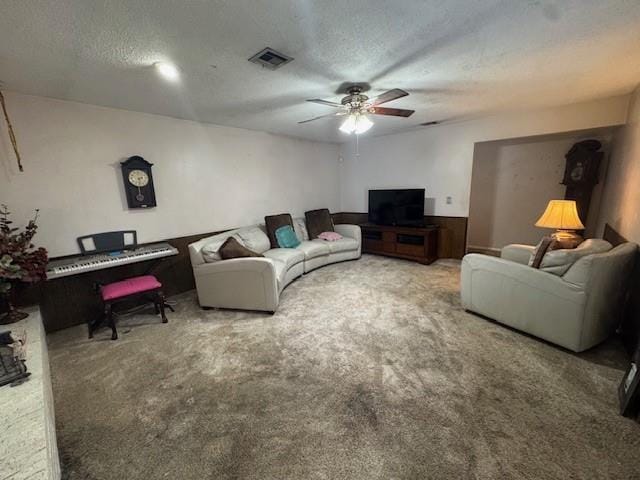 2904 N Shannon Ave, Bethany, OK 73008 - living room with ceiling fan, carpet flooring, and a textured ceiling