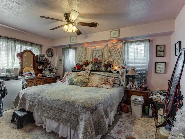 2904 N Shannon Ave, Bethany, OK 73008 - bedroom with a textured ceiling, a ceiling fan, and carpet floors