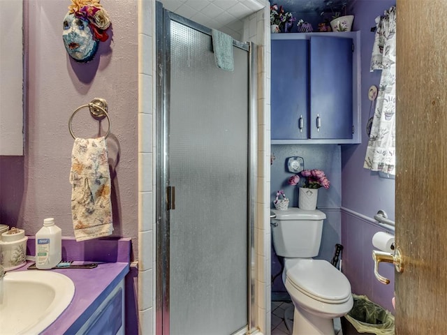 2904 N Shannon Ave, Bethany, OK 73008 - bathroom featuring vanity, a shower stall, toilet, and tile patterned flooring