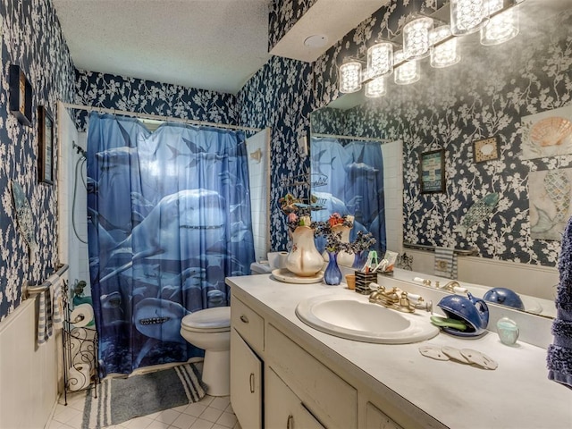 2904 N Shannon Ave, Bethany, OK 73008 - bathroom with wallpapered walls, vanity, tile patterned floors, curtained shower, and toilet