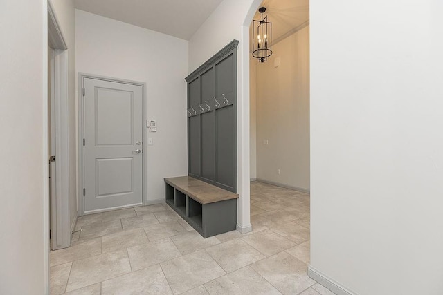 9120 SW 34th St, Oklahoma City, OK 73179 - mudroom with baseboards and a chandelier
