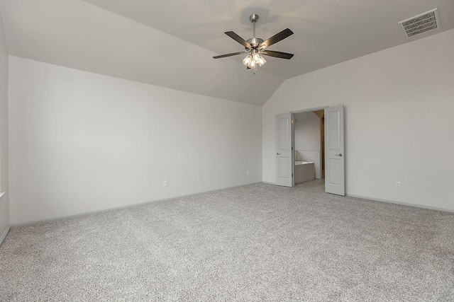 9120 SW 34th St, Oklahoma City, OK 73179 - empty room with vaulted ceiling, a ceiling fan, light carpet, and baseboards