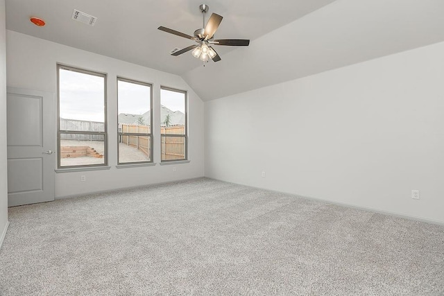 9120 SW 34th St, Oklahoma City, OK 73179 - spare room featuring ceiling fan, carpet, and lofted ceiling