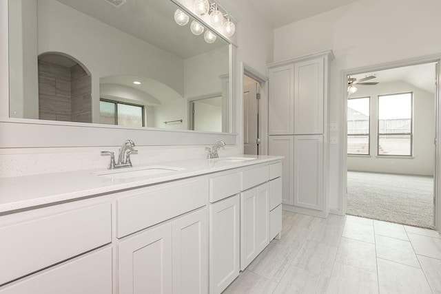 9120 SW 34th St, Oklahoma City, OK 73179 - full bathroom featuring a ceiling fan, double vanity, and tile patterned floors