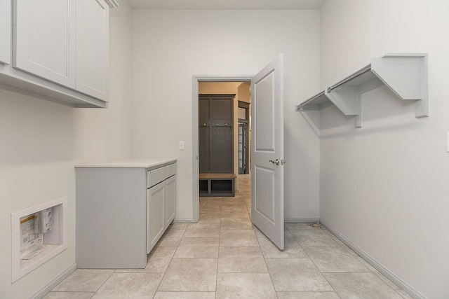 9120 SW 34th St, Oklahoma City, OK 73179 - laundry area with cabinet space and baseboards
