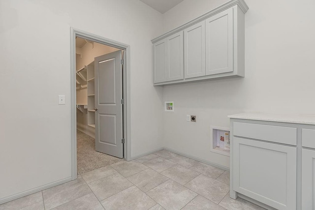 9120 SW 34th St, Oklahoma City, OK 73179 - laundry room featuring hookup for an electric dryer, washer hookup, cabinet space, and baseboards