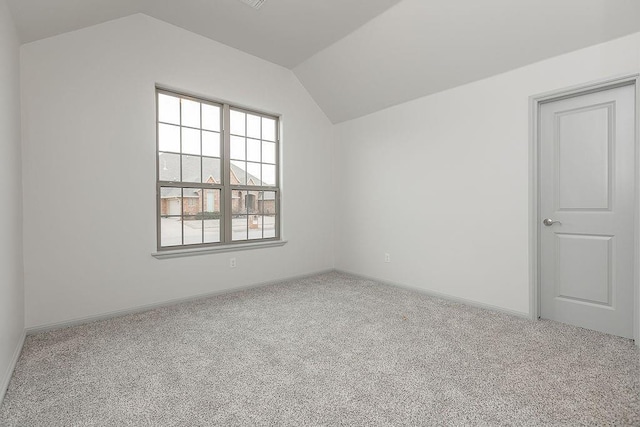 9120 SW 34th St, Oklahoma City, OK 73179 - additional living space with carpet floors, lofted ceiling, and baseboards