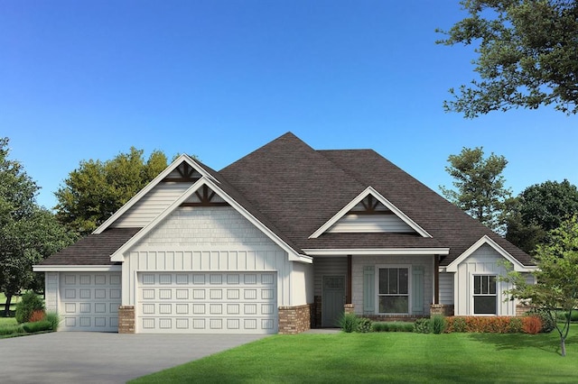 craftsman-style home with board and batten siding, a front yard, a garage, and concrete driveway