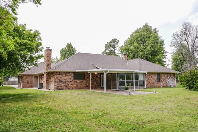 5624 N Mueller Ave, Bethany, OK 73008 - back of house featuring a chimney, a sunroom, a yard, and central AC