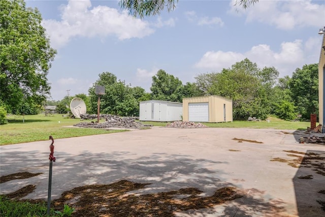 5624 N Mueller Ave, Bethany, OK 73008 - view of patio featuring an outbuilding and a garage