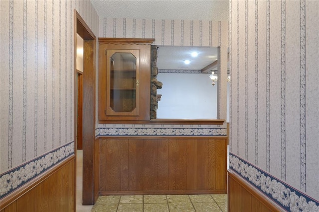 5624 N Mueller Ave, Bethany, OK 73008 - hall with wallpapered walls and wainscoting