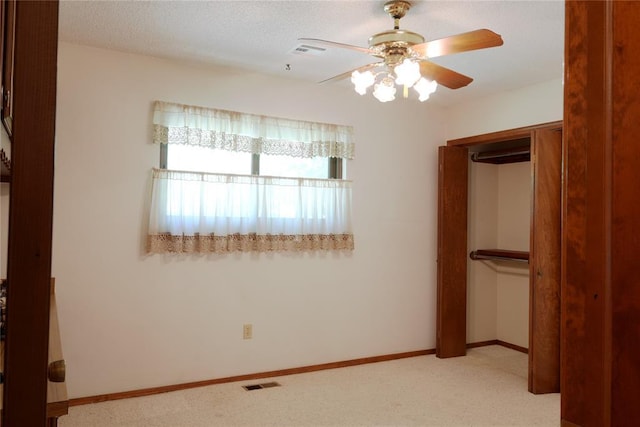 5624 N Mueller Ave, Bethany, OK 73008 - unfurnished bedroom featuring a closet, carpet, and ceiling fan